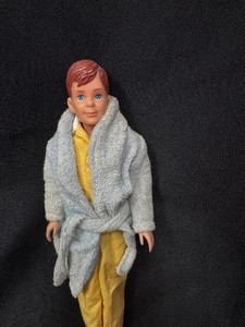 lot 8 image: Vintage Kippers Friend Ricky Doll Wearing Bathrobe