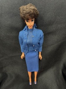 lot 12 image: Vintage Barbie Brunette Bubblecut Doll Wearing Knitting Pretty Blue Outfit