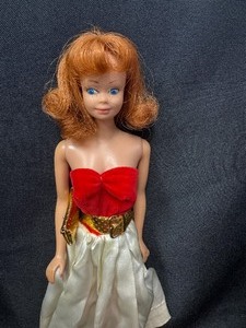 lot 13 image: Vintage Midge Doll Wearing Silken Flame Outfit