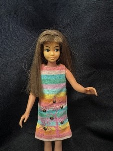 lot 27 image: Vintage Doll Wearing Sunny Pastels Dress with Sequins