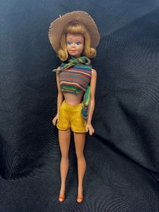 lot 37 image: Vintage Midge Doll Wearing Shorts and Straw Hat with Purse