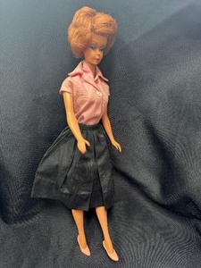 lot 41 image: Vintage Bubblecut Barbie Wearing Black Skirt and Pink Blouse
