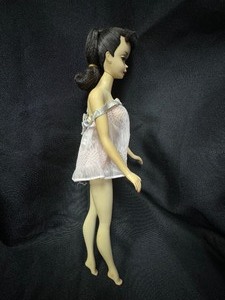 lot 42 image: Vintage Brunette Ponytail Barbie Wearing Pink Lingerie