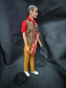 lot 43 image: Brunette Ken in A Go Go Costume with Accessories