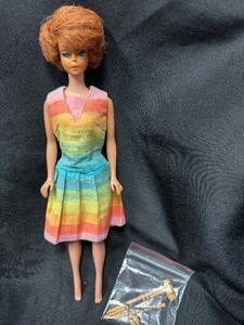 lot 47 image: Vintage Bubblecut Barbie Wearing Fun and Games Outfit with Accessories