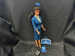 lot 73 image: Brunette Ponytail Barbie Wearing American Airlines Outfit