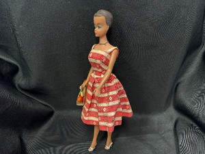 lot 87 image: Molded Hair Barbie Wearing Busy Mouring Outfit