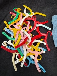 lot 132 image: Lot of Doll Clothes Hanger and Barbie Dress with Necklace