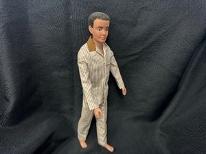 lot 148 image: Vintage Ken Doll with Flocked Hair Wearing Pajamas