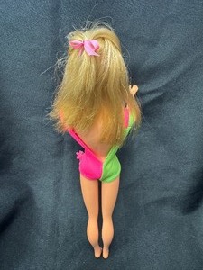 lot 149 image: Ash Blonde MOD Barbie Wearing Pink and Green Swimsuit
