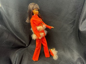 lot 317 image: Vintage Barbie Wearing Fur Sighted - Orange Variation with Bendable Legs
