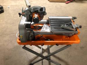 Ridgid  9 Amp Corded 7 in. Wet Tile Saw with Stand Customer Returns See Pictures