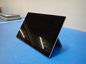lot 55 image: Microsoft&nbspSurface Pro 4 1724 Tablet &nbspINTEL(R) CORE(TM) I5-6300U CPU  2.40GHZ  8GB RAM  256GB SSD  NO OS  No Charger &nbspWhite spots & Screen yellowing, light scratch in screen