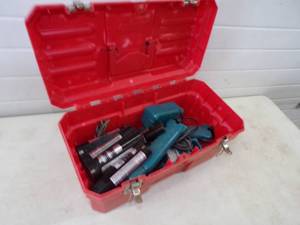 Red Tool Box with Makita Cordless Drills, Batteries and Chargers
