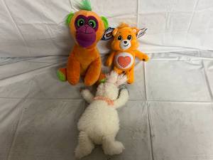 lot 199 image: Monkey, Care Bear, and Rabbit Toys
