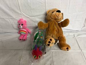 lot 211 image: Care Bear, Cattepillar, and Teddy Bear Stuffed Animals