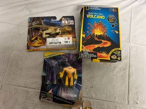 lot 228 image: Jurrasic World Toy, Build Your Own Volcano, and Lughtyear Toys