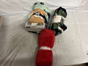 lot 243 image: Baby Yoda Toy with Blanket and 2 Throw Blankets