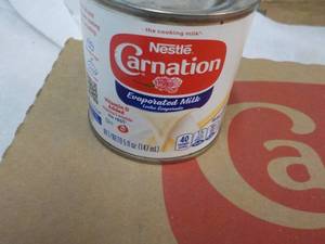 lot 491 image: 24 ct 5oz Cans Nestles Carnation Evaporated Milk-8312023