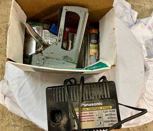 lot 28 image: Panasonic Universal Charger & Craftsman Stapler wStaples