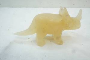 lot 23 image: Carved Yellow Onyx Dinosaur