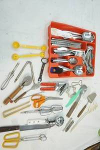 lot 76 image: Red Utensil Holder with Silverware and Kitchen Utensils
