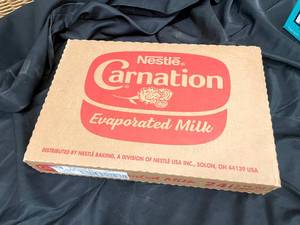 lot 260 image: Nestle Carnation Evaporated Milk 24 5oz cans Best By 08312023
