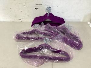 lot 317 image: LOT OF 49 Purple Suede Hangers