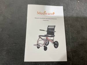lot 50 image: Medwarm Lightweight Ultralight Transport Wheelchair with Handbrake, Compact