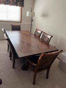 lot 47 image: Exquisite Legacy Classic Larkspur Trestle Table with 4 Side Chairs, 2 Arm Chairs, 2 Table Leaves, and Table Clothes in Mint Condition