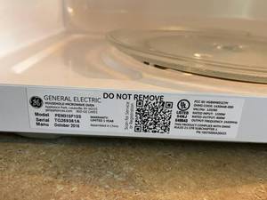 lot 85 image: GE Stainless Steel Model PEM31SF1SS 800-Watts Microwave Oven in Excellent Condition