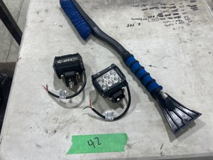 2 DRIVING LIGHTS & WINDOW SCRAPER