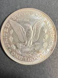 lot 18 image: 1 TROY OZ .999 FINE SILVER MORGAN DOLLAR DESIGN ROUND