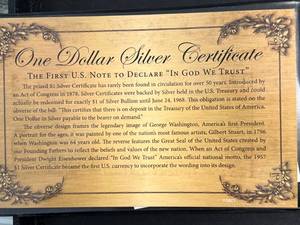 lot 89 image: 1957A BLUE SEAL $1 SILVER CERTIFICATE IN INFO. BOOK