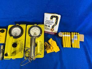 lot 94 image: Radiology Monitor  Radiation Detection Kit. Includes two Geiger Counters, and original 1963 Department of Defense user manual. Originally property of the State of Minnesota.