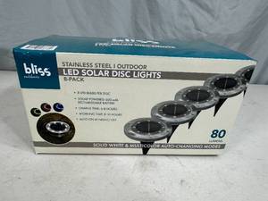 lot 57 image: New 8 Pack LED Solar Disc Lights