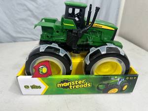 lot 95 image: New John Deere Monster Treads Tractor with Light up Wheels
