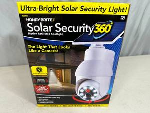 lot 146 image: New Solar Security 360 Motion Activated Spotlight - Looks like Camera