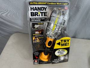 lot 209 image: New Handy Brite Cordless Worklight