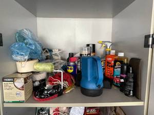 lot 28 image: Entire Shelve Goes Various Car Cleaning Concentrates and Detailing Chemicals Rags  Flashlight Bunji Cords  Zip Ties