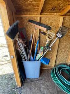 lot 95 image: Bin Full of Outdoor Tools  Brooms  Racks  Gardening Hoe  Canes  Mop