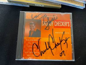 lot 227 image: Lot of 22 CDs (some unopened) Inc Elvis and an Autographed Chubby Checkers (unverified) & CD Rack