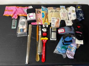 lot 245 image: Lot of Womens Socks ( 12 new wtags) , New Queen Sz Nylons in Pkg (7 pr), 3 Shoe Horns, 1 Disney Backscratcher & More