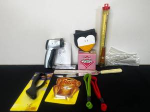 lot 273 image: Penguin Oven Mits, Pop Up Timers, Variety of Thermometers (untested), Jar Openers, Knife, Popcorn Ball Maker, etc.