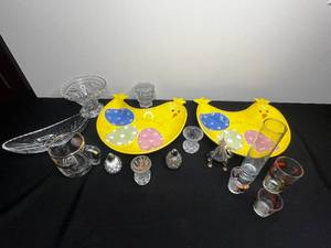 lot 299 image: 6 Egyptian Perfume Bottle w Gold Painted Trim (Camel), 2 Easter 12 Serving Trays (1 w repaired chip), Crystal Salt & Pepper w Toothpick Holder, Geese Decorated Shot Glasses & More