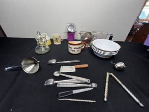 lot 313 image: 4 Corelle Dishes, 2 Measuring Cups, Nutcracker, Patty Maker, VTG Cowboy Squirrel Childs Cup & Misc Utensils