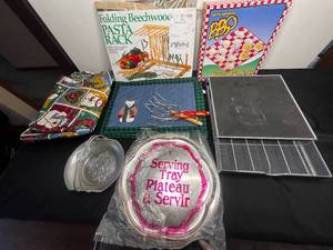 lot 319 image: K Cup Storage Unit, Deviled Egg Plate, Pasta Rack, Silver Tone 14 Serving Tray & 8.5 Bowl w Handle, 4 Teddy Bear Seasonal Place Mats