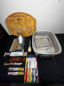 lot 323 image: VTG Grandmas Original Turkey Board (great charcuterie board), 2 Turkey Broilers w Baster, 4 Pc ParingUtility Set Chicago Cutlery, VTG Cookie Press (all parts unverified), 2 Paring Pro Knives,