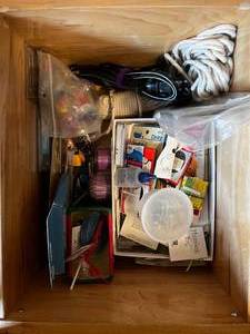 lot 427 image: 2 Sewing Desk Drawer Contents (not inc drawers) Inc 64 Box of Crayons, Block Tool, Elastic, Fasteners, Misc Sewing Supplies, Universal Power Cords & More