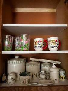 lot 442 image: Lot of Kitchen Cupboard Contents Inc Pfaltzgraff Naturewood Accessories - Platter, Soap, Food Storage Containers, Cheese Tray and Spreader, Large Bowls, Spoon Holder, Divided Tray, Mugs (1 Canada Mug Chipped) and More Misc